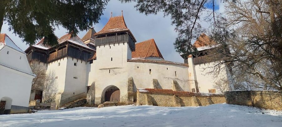 From Brasov: Sighisoara, Viscri, and Rupea Unesco Day Trip - Viscri’s White Church and the climb for panoramic views