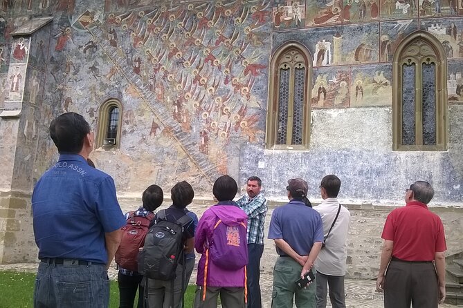 Half Day Tour to Bucovina Painted Monasteries - Humor Monastery: red-brown frescoes and the Devil as the Scarlet Woman