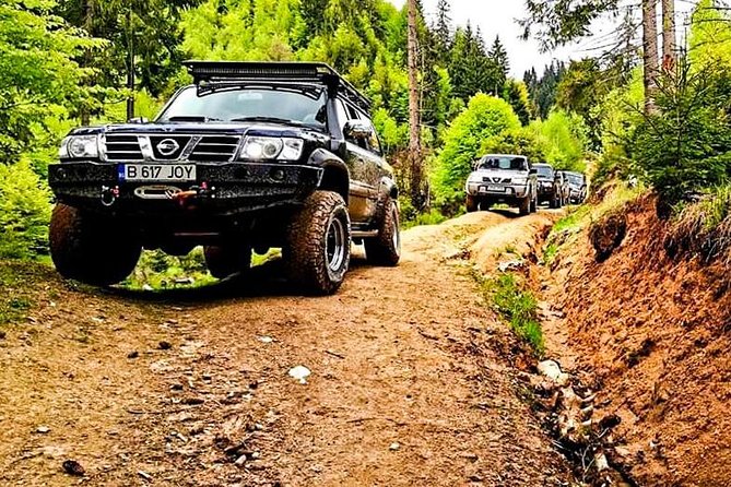 Off Road Adventures in Wild Carpathians - 5 Days - Day 1 from Bucharest to Bucegi: Bolboci Lake and peak views in a Nissan Patrol style jeep