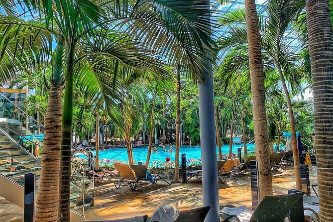 Relax and Fun at Thermal Spa Bucharest (Admission Ticket) - Palm’s tropical setup: heated pools, mineral baths, and a sand beach