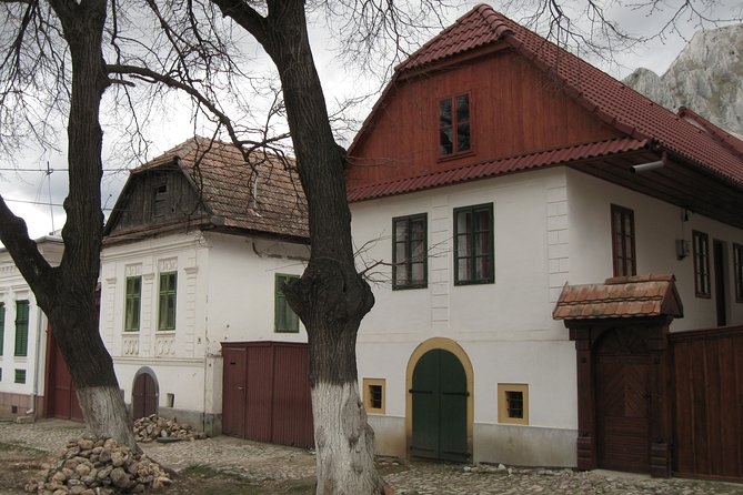 Turda salt mine, Rimetea village and Alba Iulia, from Cluj - Rimetea in the Apuseni Mountains: white houses, iron history, and gate symbols